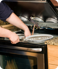 Technicans from the Liberty Appliances Service is reparing Stove