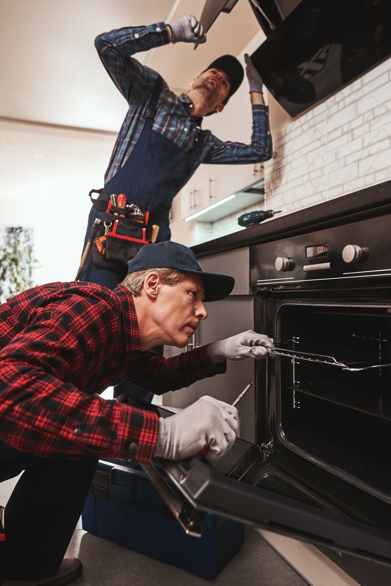 Productive together. Photo of two mechanics working at the kitchen