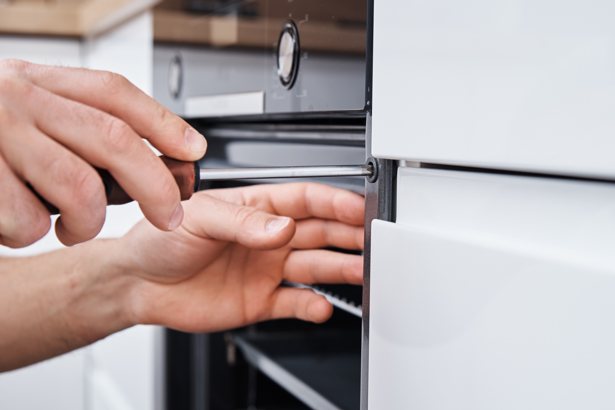 Handyman install oven in the kitchen